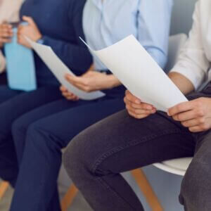 people seating holding papers