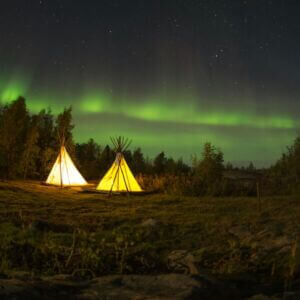Tents on Green Field Under Aurora Borealis
