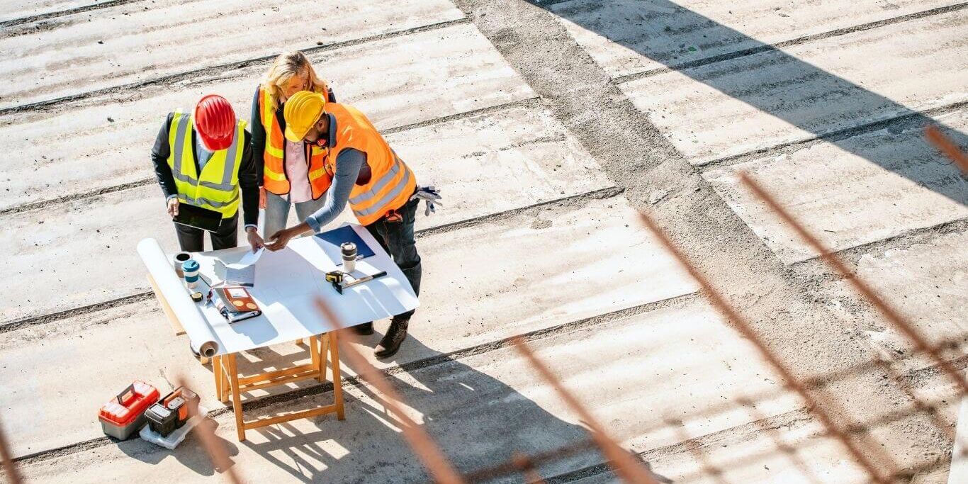Sovereign-Wealth-Fund-banner Construction Site Project Team Checking Plans